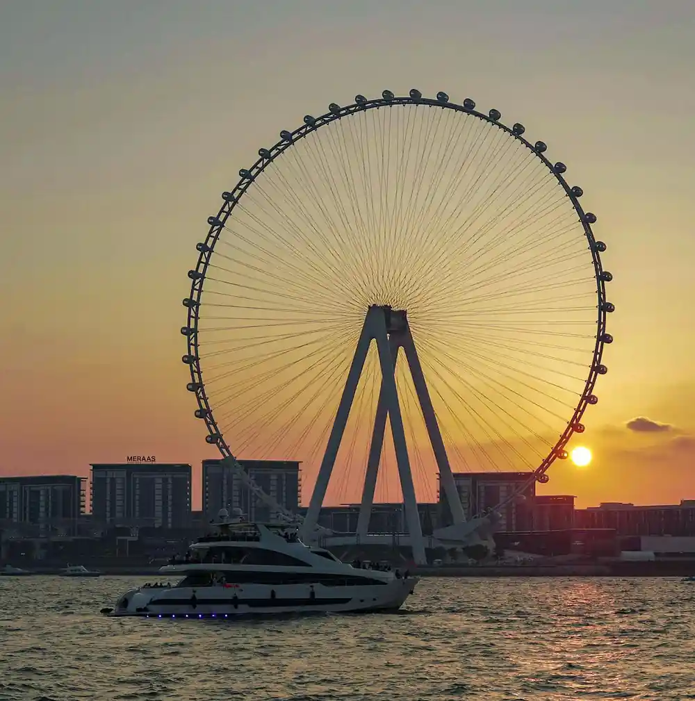 The observation wheel at sunset seen across the water