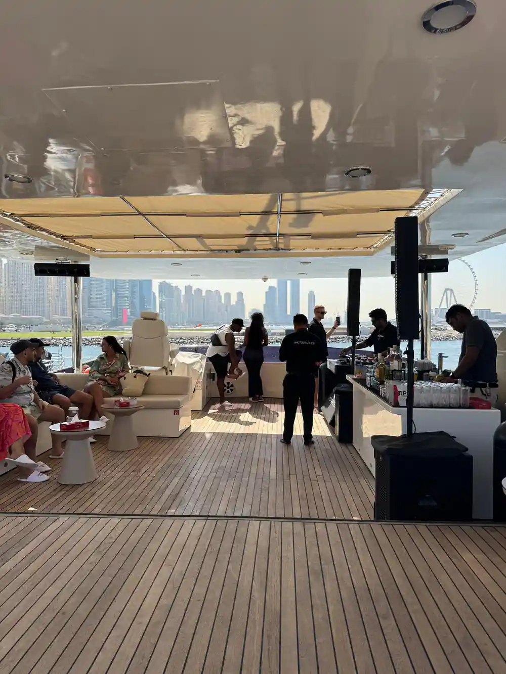 The shaded upper deck with seating and guests