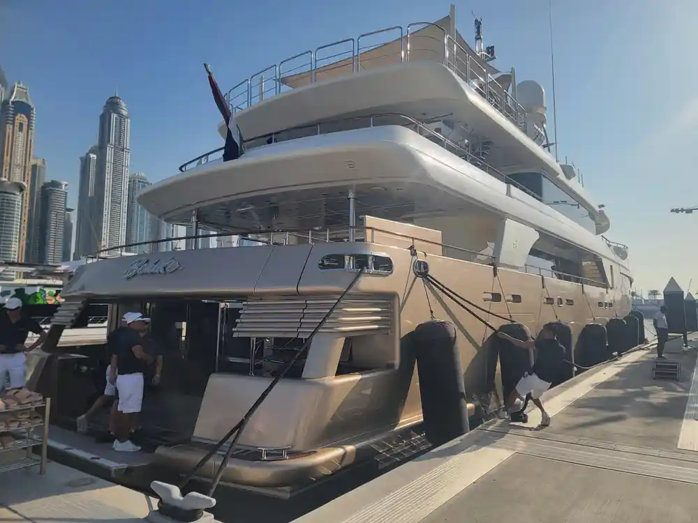 The yacht's stern and boarding platform from the quay
