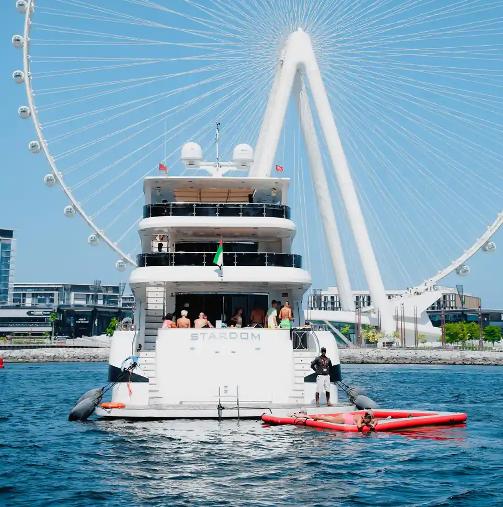 The yacht's three decks seen from the water below the big wheel